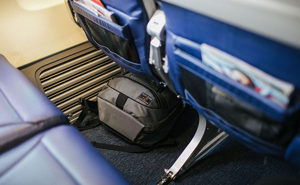 Synik 22 stowed under airline seat